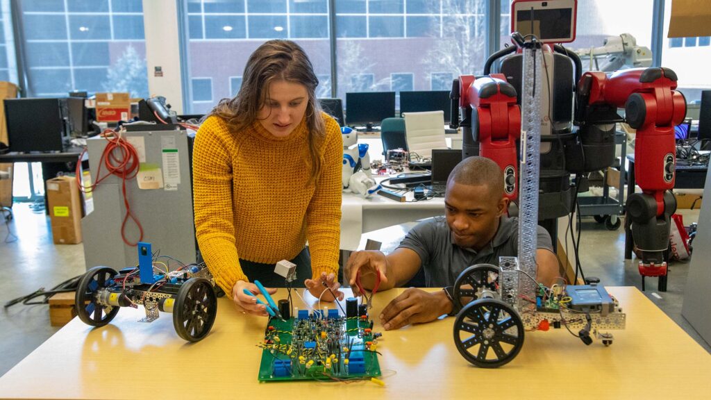 Two students working on circuits together