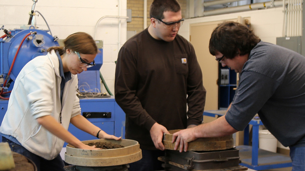 students working with machinery