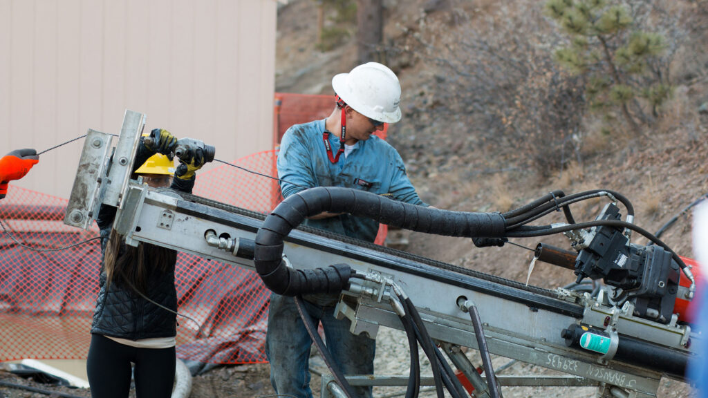 Student working with machinery near the Edgar Experimental Mine