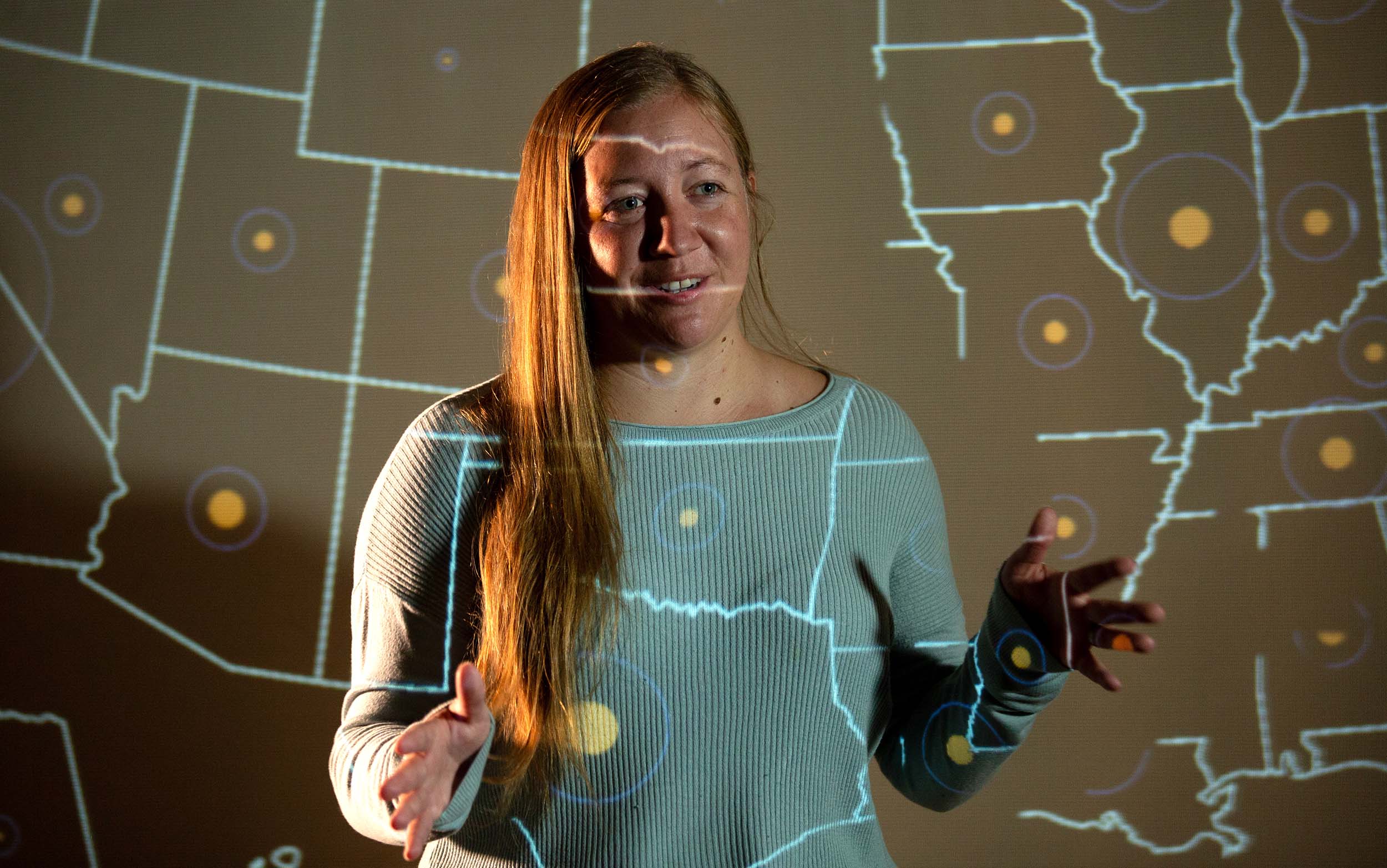 Colorado School of Mines student working with a digital map of the United States