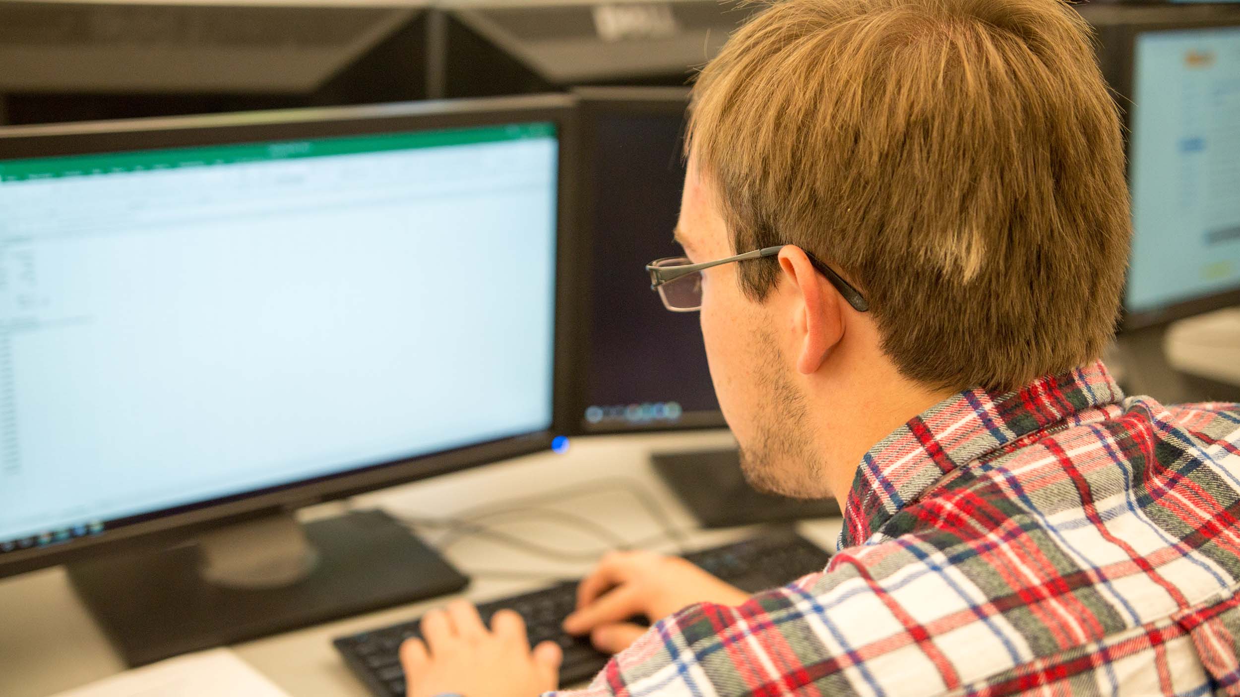 Student sending an email from their computer