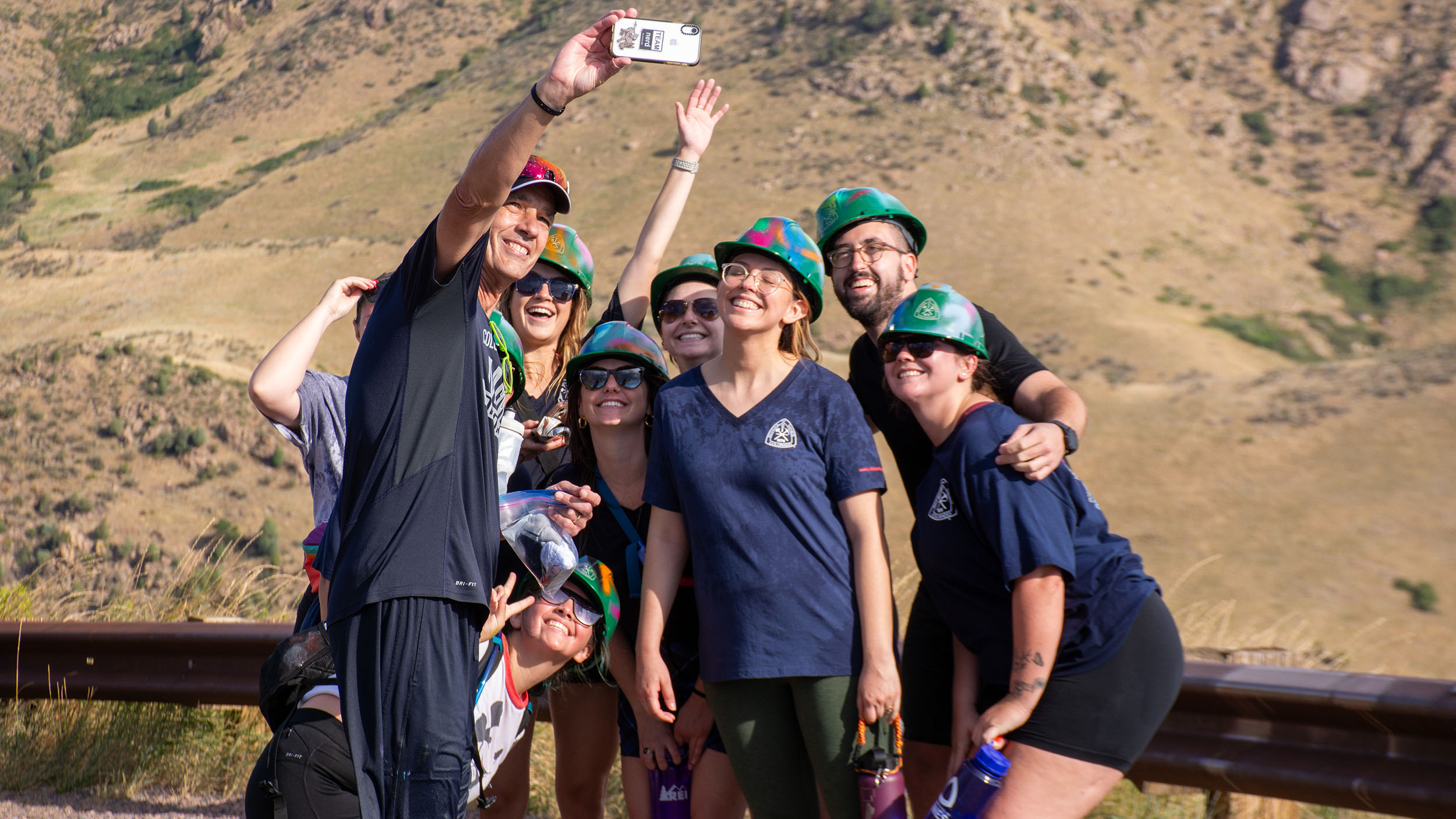 Colorado School of Mines students taking a selfie with President Johsnon for social media posting during the M Climb