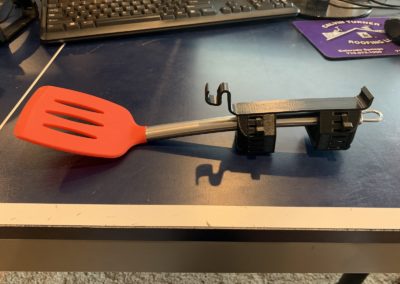 Cuff attached to a spatula