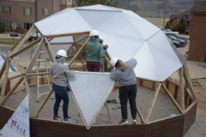 Team members building the Mines Tiny Greenhouse the first day of construction.