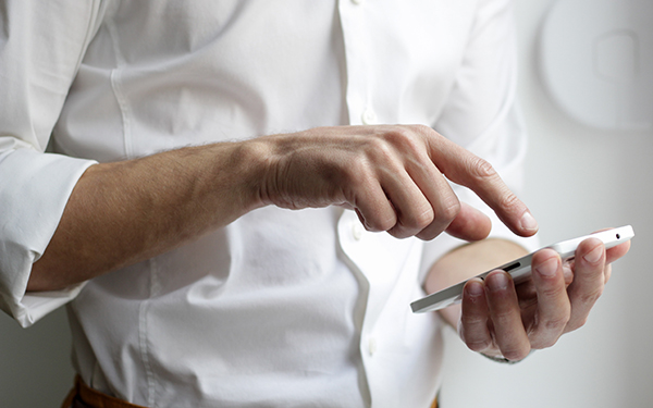 man texting on mobile