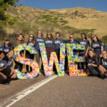 SWE students with large S W E letters at M Climb