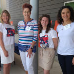 Four female staff members posing for a picture