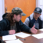 Two male students studying together