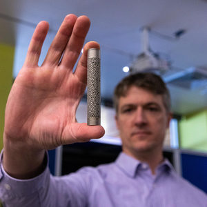 Man holding metal pellets