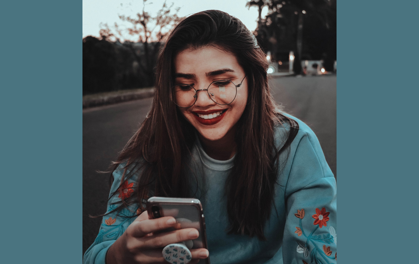 cell girl looking at cell phone