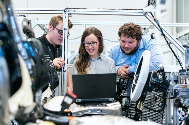 Engineers on car assembly line