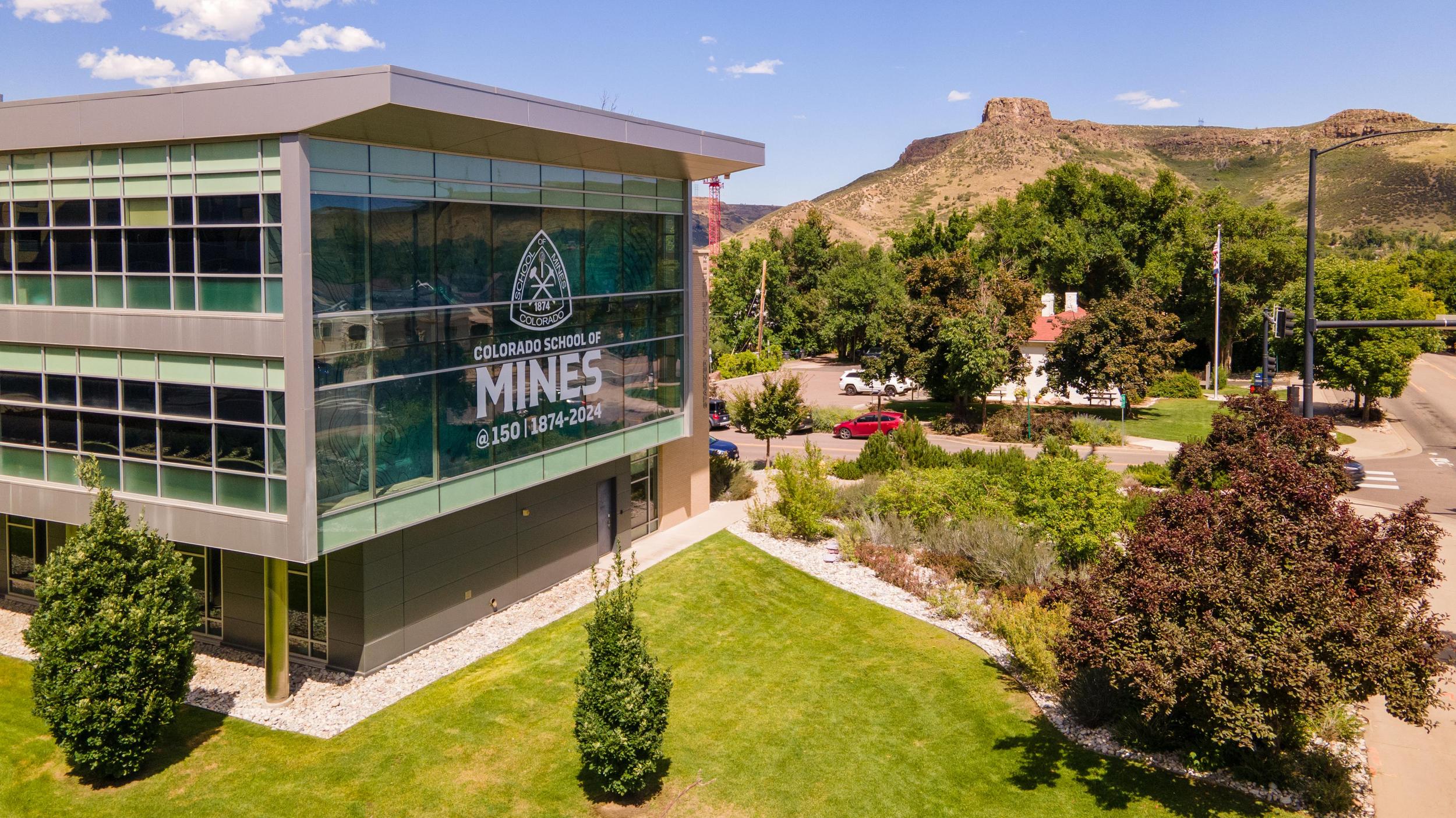 Aerial of Starzer Welcome Center on Mines Campus on a sunny blue sky summer day