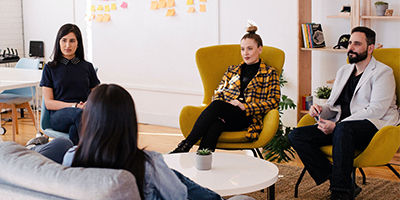 small group talking in casual office environment