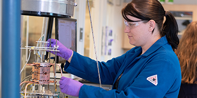 student working with lab equipment