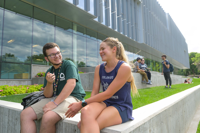 51629718384_f2e9af4e32_c Students sitting and talking outside