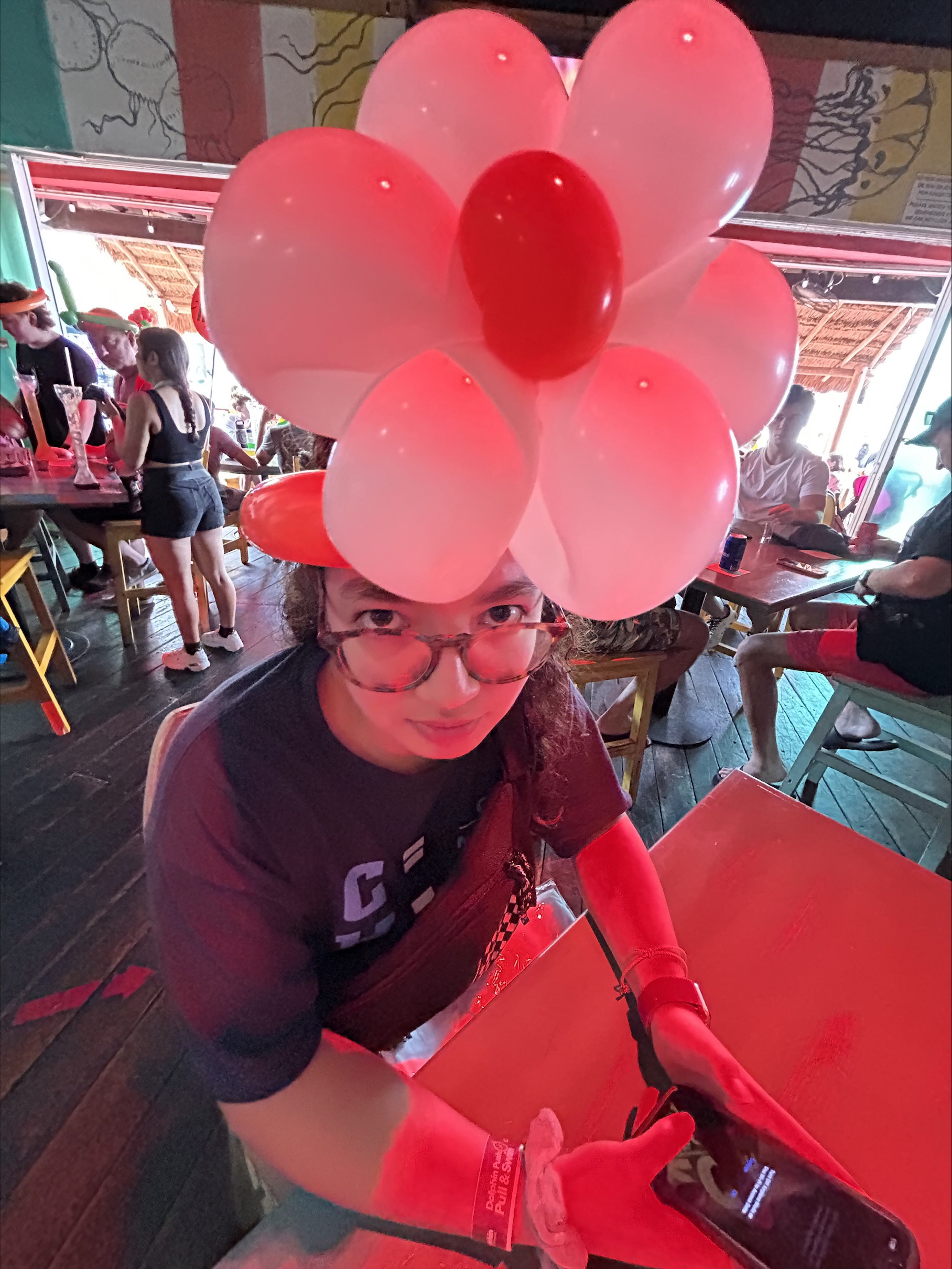 Student with flower balloon hat
