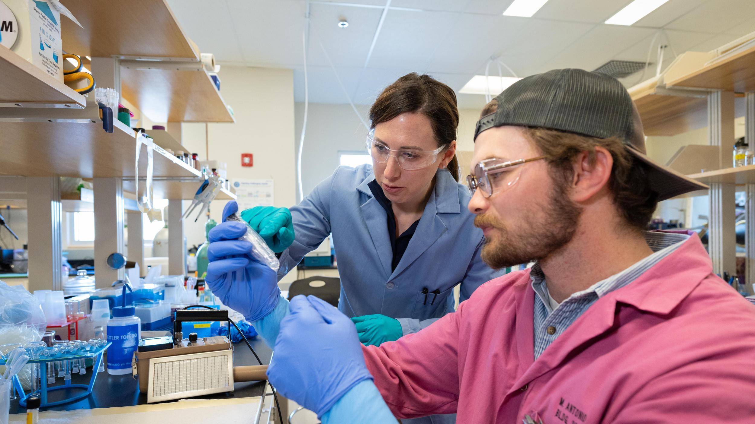 Nuclear Scientist Jenifer Shafer works with a grad student in the radio chemistry lab at Mines.