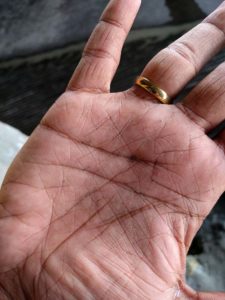Gold flecks in a student’s hand, small scale mine site, Colombia