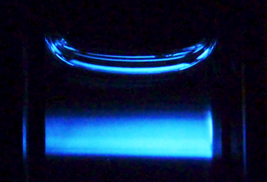 Fluorescence caused by laser passing through ionic liquid.
