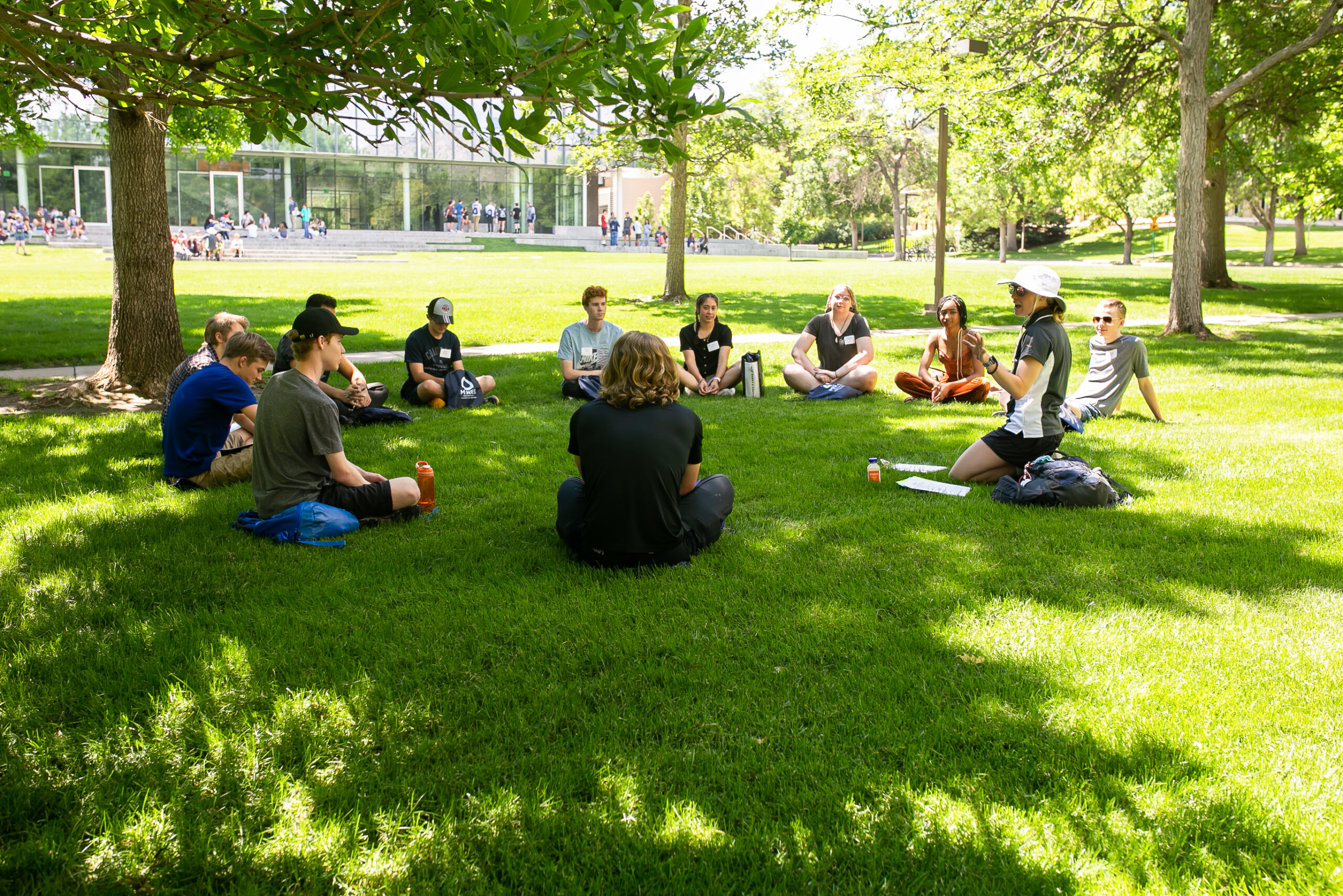 Students sitting in a circle in Kafadar Commons