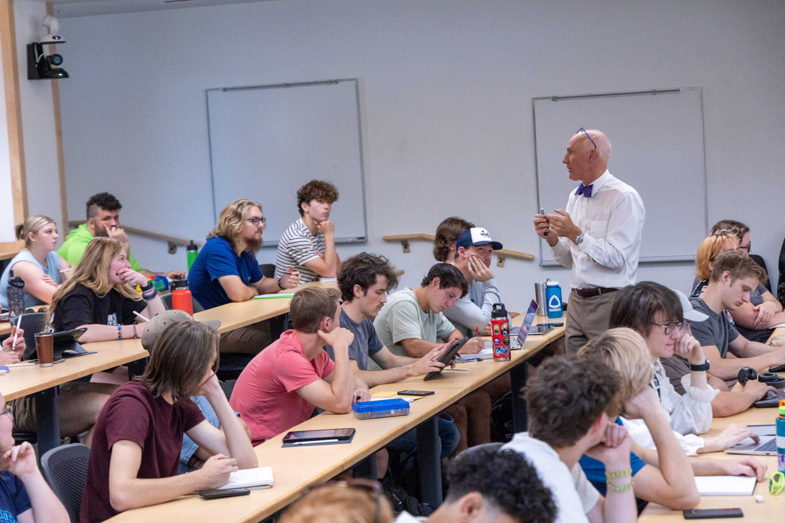A professor teaching class in a lecture hall
