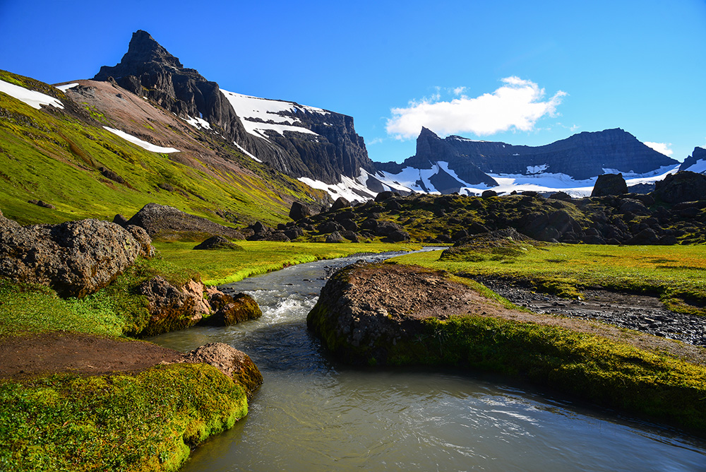 The boulders, peaks and crystal clear rivers of the spectacular Stórurð valley, East Fjords, Iceland