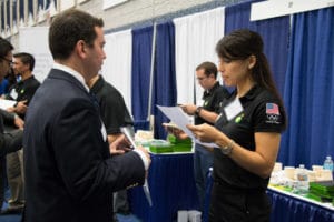 student and recruiter talking at career fair