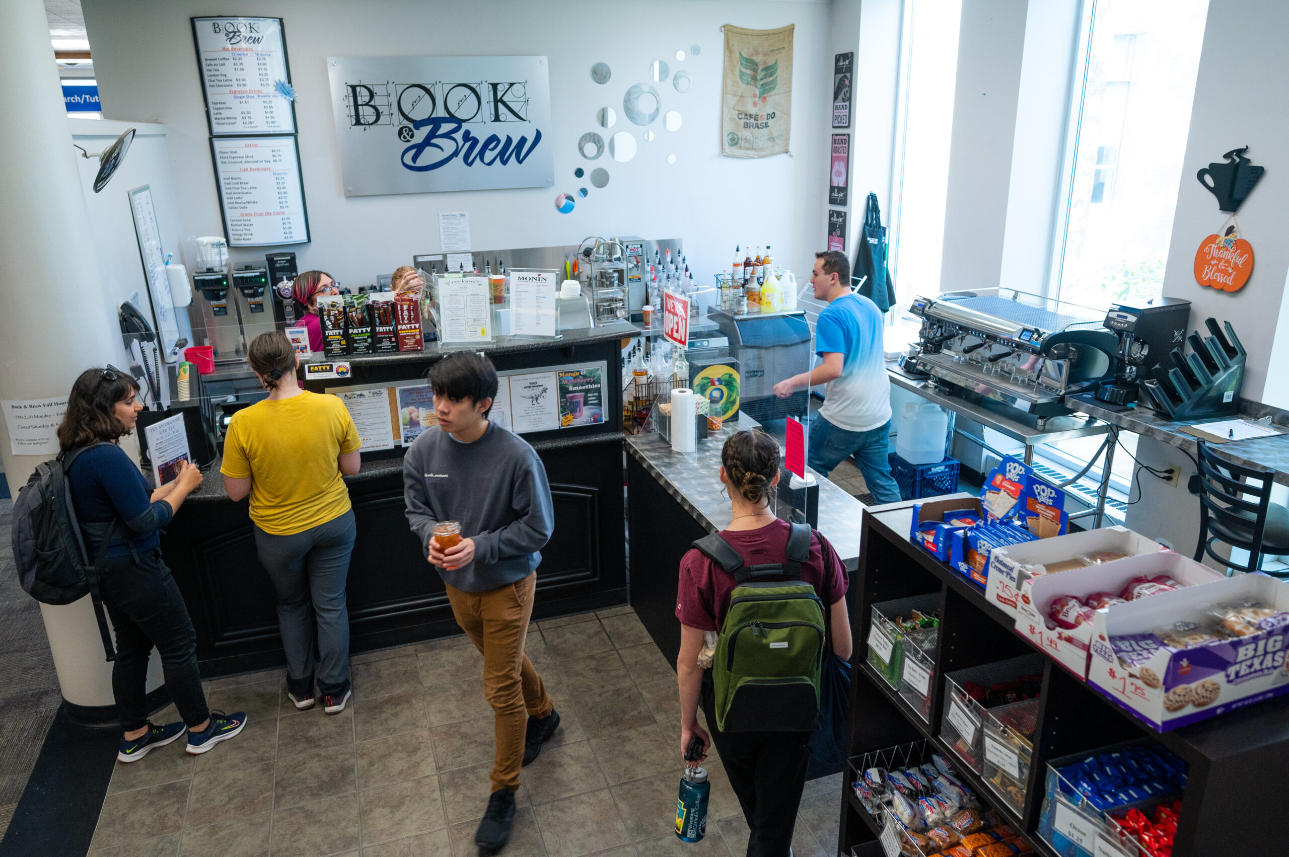 Students at the Book and Brew located in the Arthur Lake Library.